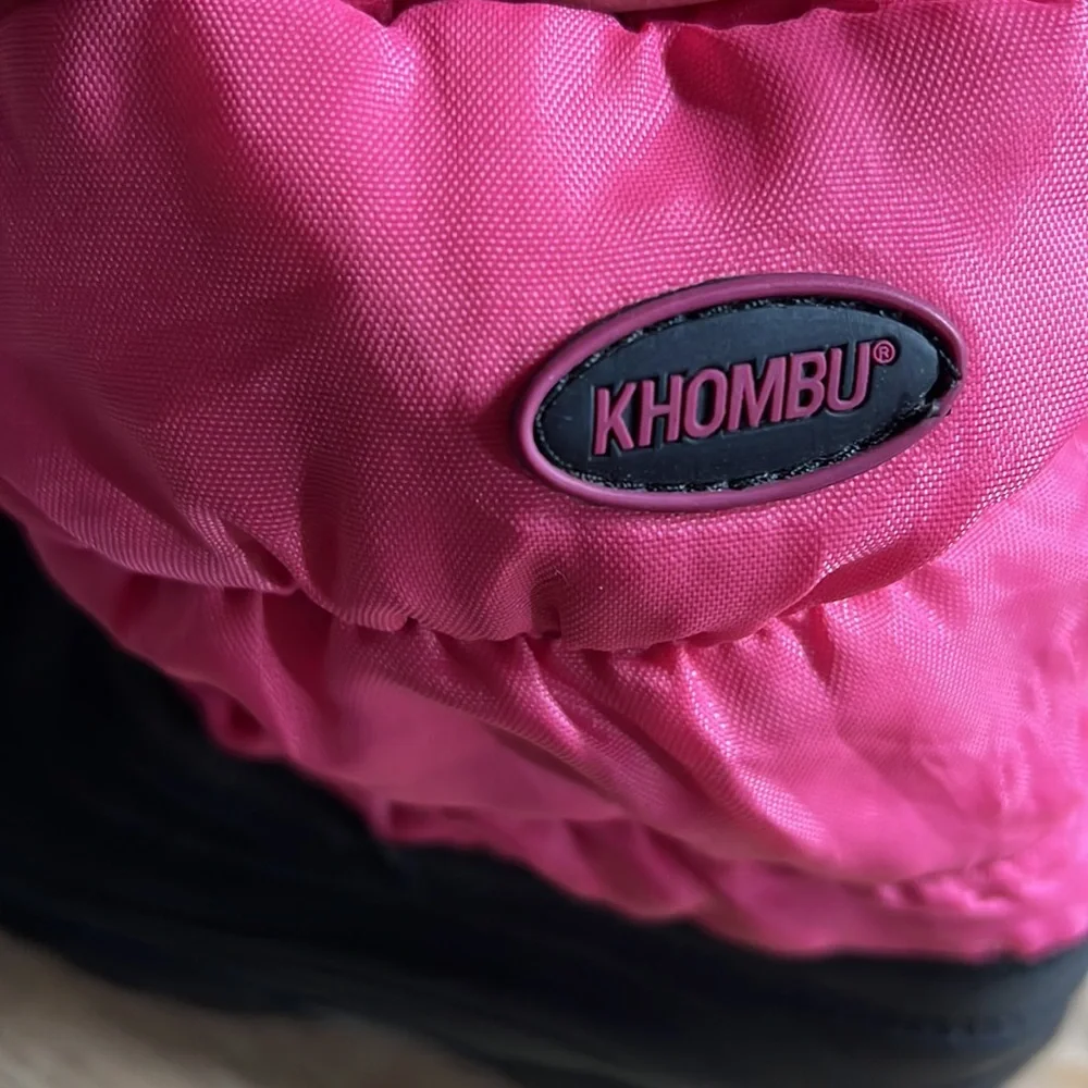 Size 13 girls winter snow boot by Khombu. Pink and black. Lightly worn.